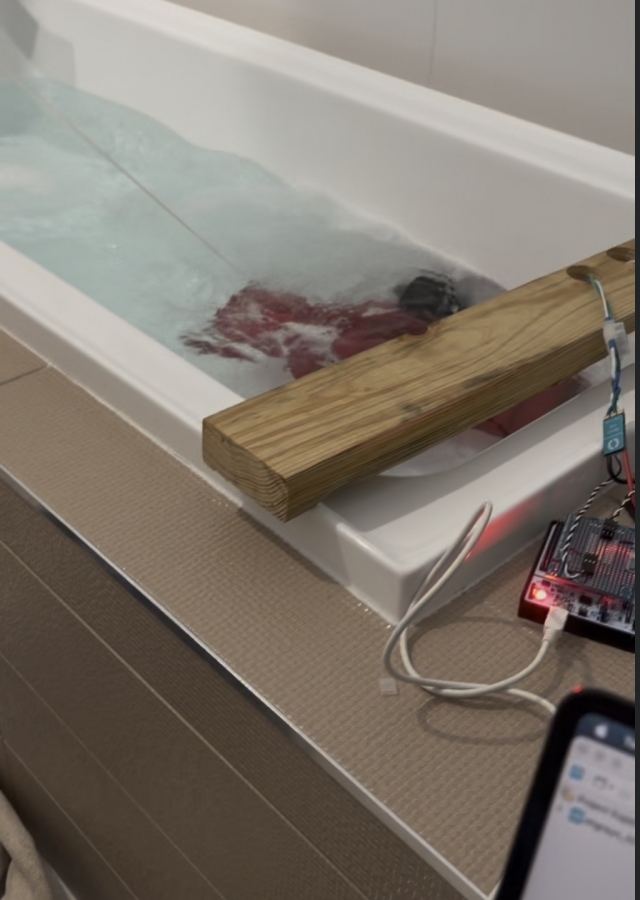 Frame from the powered AUV wet-test video with both thrusters operating in the test tank